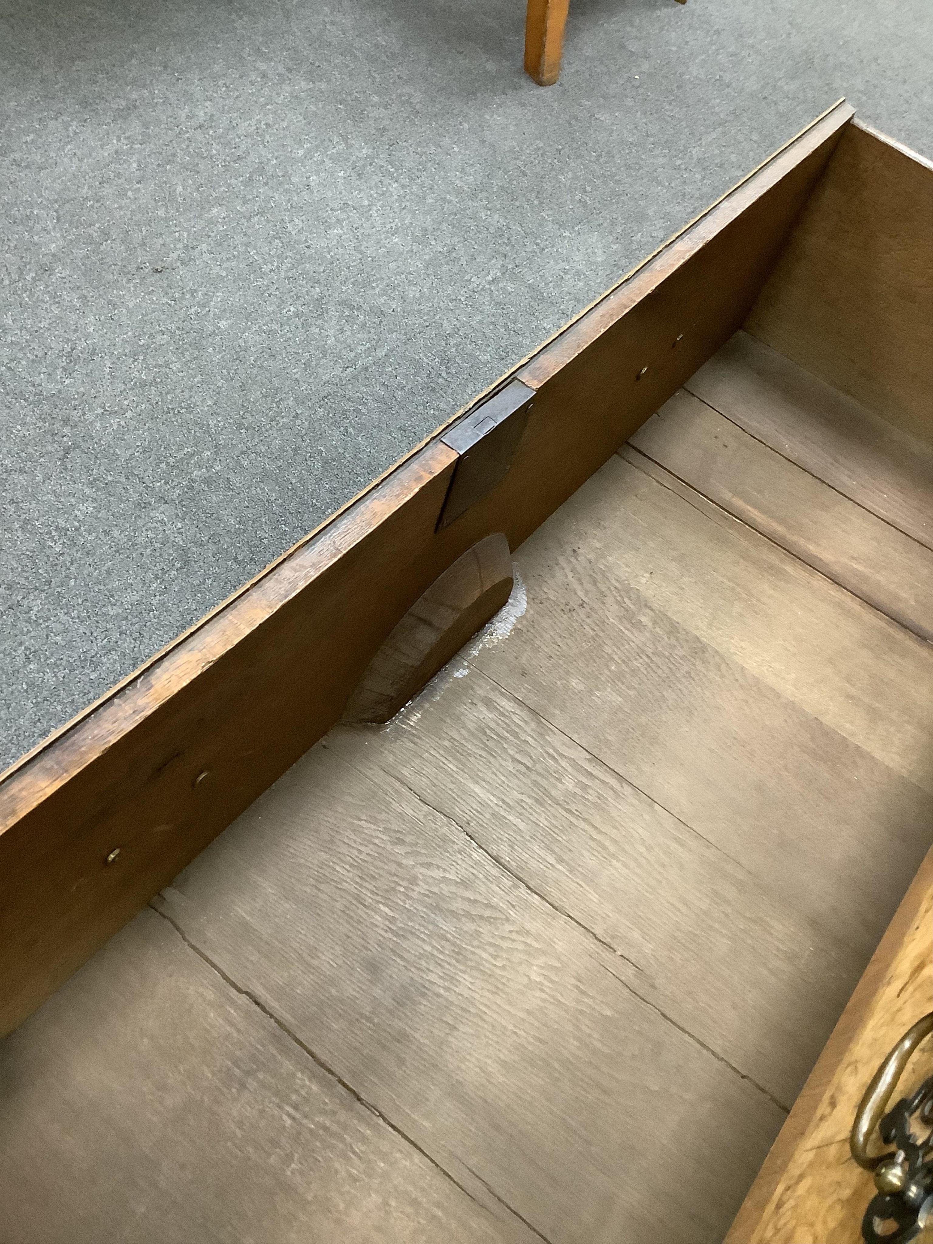 A mid 18th century feather banded walnut concave starburst walnut chest of three drawers, with brushing slide, width 108cm, depth 54cm, height 92cm